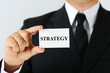 © 5second - Businessman holding card with word Strategy