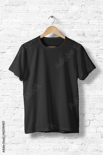 Blank Black T-Shirt Mock-up hanging on white wall, rear side view . Ready to replace your design ...