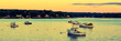 Lobster boats moored in the Sheepscot River at the Wiscasset Waterfront at sunset