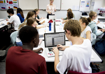 Wall Mural - group of students learning in classroom