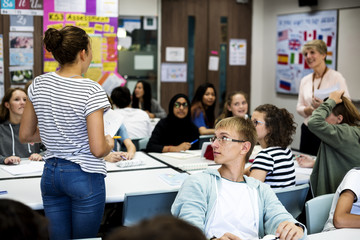 Wall Mural - group of students learning in classroom
