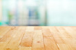 © Atstock Productions - Wood table top on blur white green abstract background