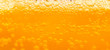 bubble beer close up / yellow background / water / drink