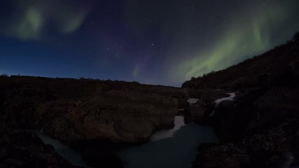 Wall Mural - bright strong aurora northern lights rugged volcanic lava field glacial river waterfall barnafoss ic