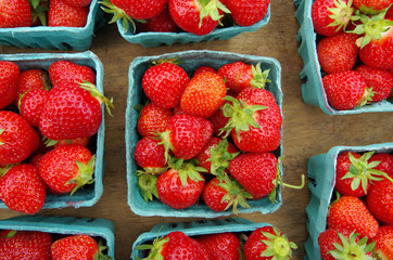 Wall Mural - Strawberries displayed in baskets for market on wooden table