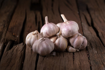 Fresh herbs and spices Garlic over old wooden background