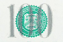 Close Up Of Number 100 With THE DEPARTMENT OF TREASURY 
Seal On One Hundred US Dollar Bill.