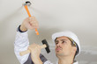 © auremar - man is hammering the ceiling