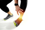 Runner sportsman holding ankle in pain with Broken twisted joint running sport injury and Athletic man touching foot due to sprain on white background