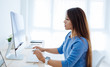 © That Stock Company - Young asian woman working in the office