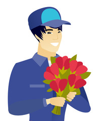 Sticker - Young asian mechanic holding a bouquet of flowers