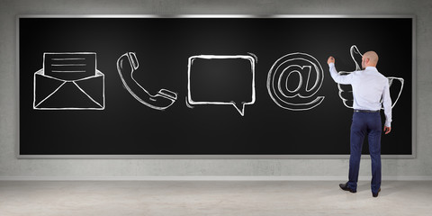 Wall Mural - Businessman drawing e-mail sketch on a board 3D rendering
