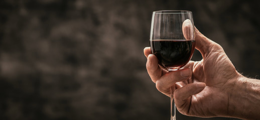 Wall Mural - Man tasting a glass of red wine