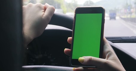 Driver closeup, greenscreen in the car, urban city backgroundgreen screnn chrome key 4k