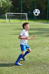 Poster - Boy soccer playing with ball