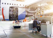 © aapsky - Aircraft service, view of the engine of the aircraft and with a technician at the computer