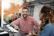 © goodluz - Start-up people working on desktop in co-working space