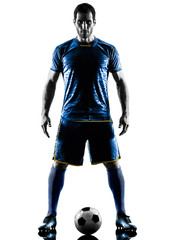 Wall Mural - one caucasian soccer player man standing in silhouette isolated on white background