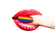 © Tverdokhlib - Rainbow flag manicured nail in mouth