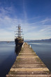 Pirate ship moored  to a wooden pier