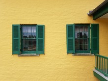 Yellow Building With Green Shutters