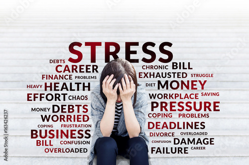 Cuadros en Lienzo Depressed business woman sitting on stair
