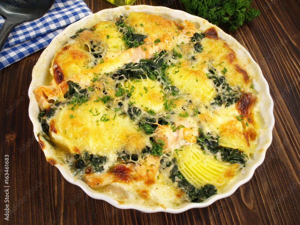 Kartoffelgratin mit Lachs und Spinat Stock Photo | Adobe Stock
