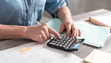Female Accountant Using Calculator