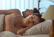 © realstock1 - The attractive couple sleeping in the bed. full grip focus