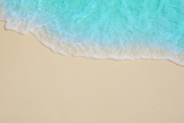  Soft waves of blue sea on the Maldives beach for the background.