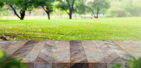 Aufkleber - Empty grunge wooden plank table top with blur park green nature bokeh and leaf foreground,Mock up for display or montage of product