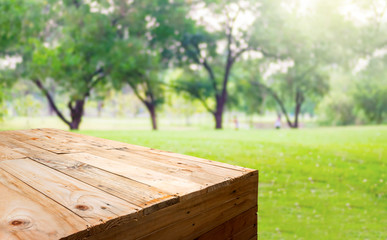 Aufkleber - Empty wood plank table food stand with blur tree in park bokeh light background,Template mock up for display or montage of product.