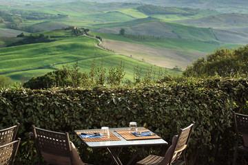 Wall Mural - view from the restaurant on the Tuscan field at sunset.