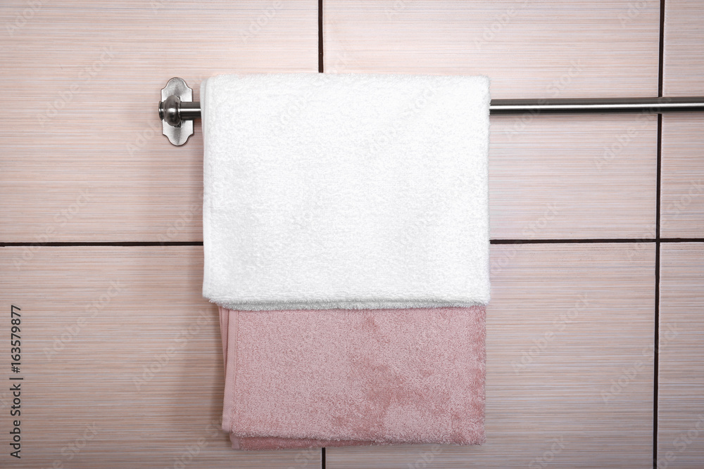 Clean towels on hanger in bathroom
