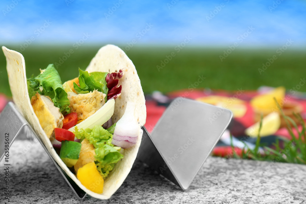 Delicious fish taco in holder outdoor