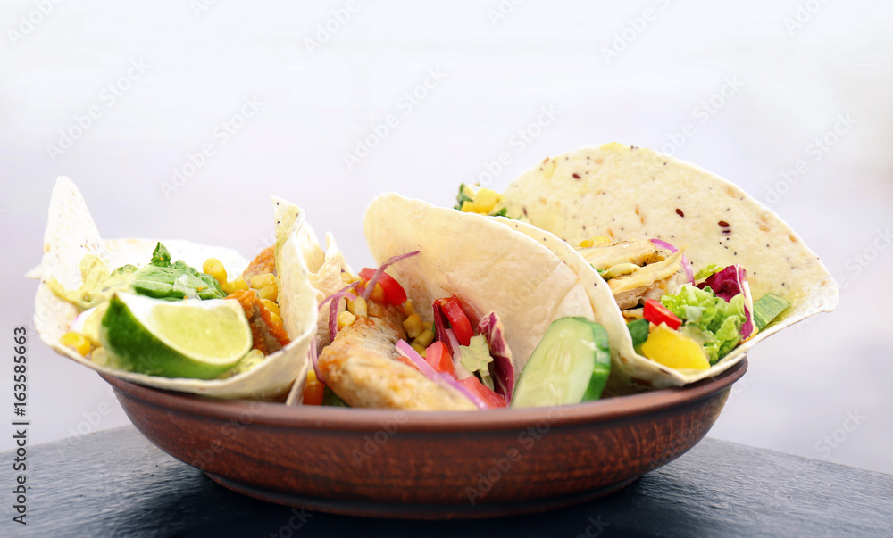 Plate with delicious fish tacos outdoor