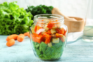 Wall Mural - Delicious carrot salad in jar on kitchen table