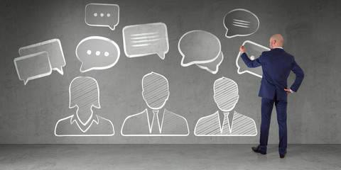 Wall Mural - businessman drawing discussion icons sketch on a wall 3d rendering
