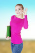 © Piotr Marcinski - young casual woman student showin OK gesture.