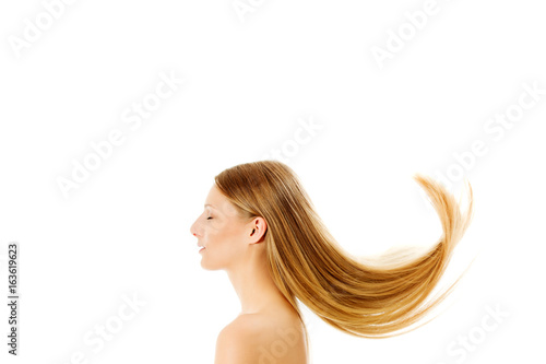 Plakát Beautiful long blonde hair, isolated on white.