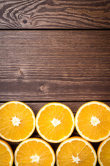 Sticker - Half cut oranges on an old wooden table