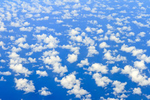 Aerial View On Some Clouds In The Sky Above The Ocean Seen From Above 
