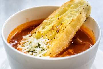 Wall Mural - italian minestrone soup with garlic bread and grated cheddar cheese