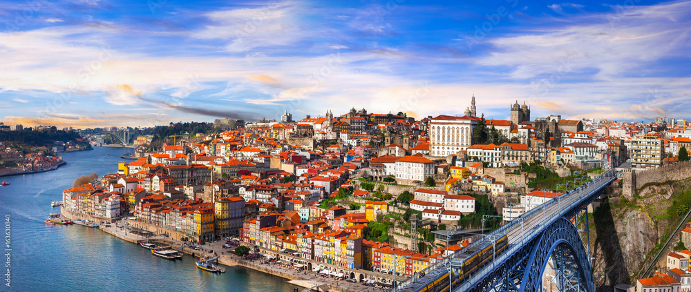 panorama of beautiful Porto over sunset - view with famous bridge of Luis, Portugal - obrazy, fototapety, plakaty 