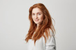 © Cookie Studio - Portrait of cheerful happy beautiful girl with foxy hair smiling looking at camera over white background.