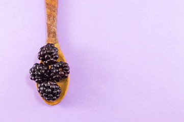 blackberries in a wooden spoon