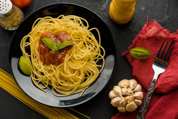 Spaghetti with tomato sauce and their ingredients around .Adjustment size for banner, cover and header.