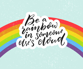 Wall Mural - Be a rainbow in someone else's cloud. Positive inspiration quote with rainbow at blue sky background
