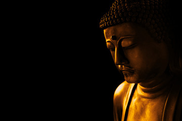 Wall Mural - closeup face of zen stone art buddha in dark for background asian way tranquil of meditation and religious.