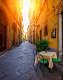 Fototapeta Uliczki - Narrow old cozy street in Lucca, Italy